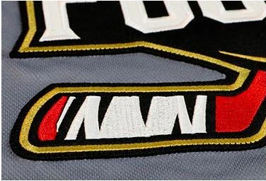 Embroidered hockey jersey crest detail